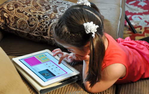 Child using educational tablet app