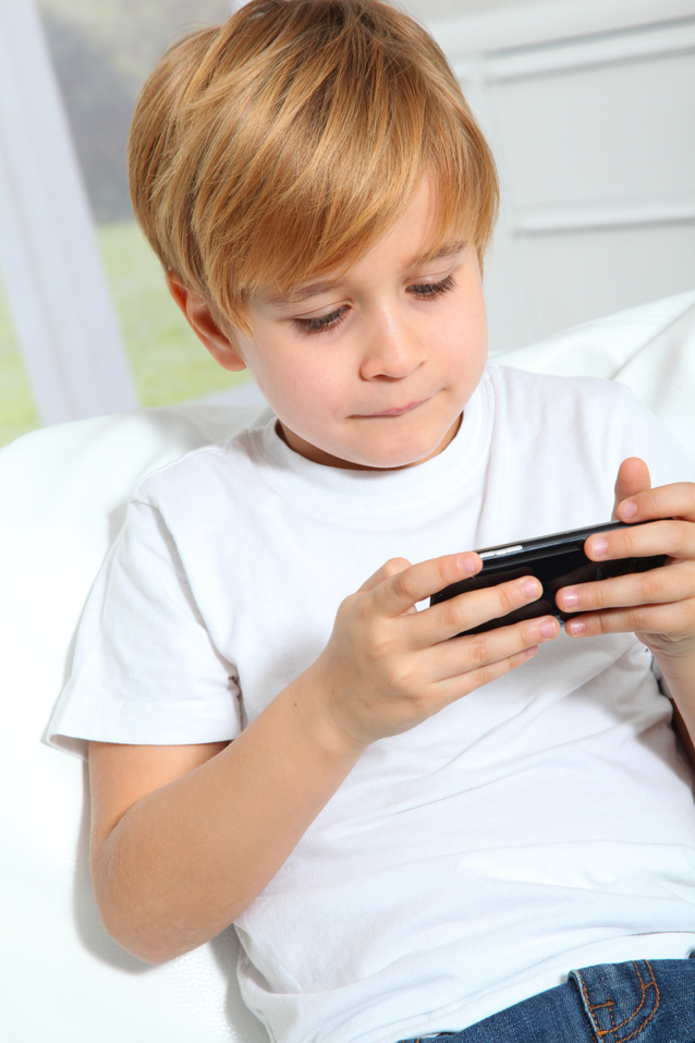 Young learner with device