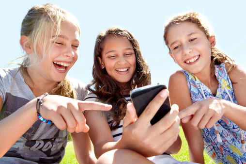 Children collaborating with mobile learning